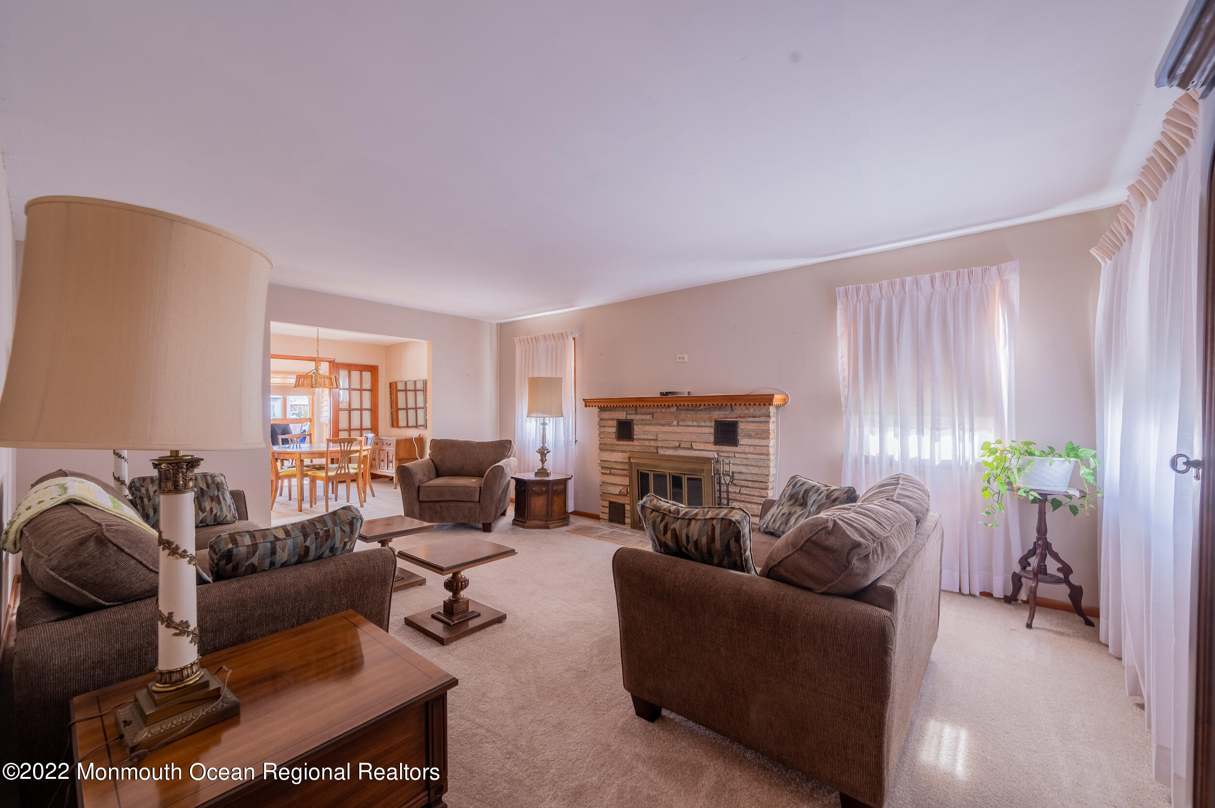 23 Neptune Road Toms River, NJ 08753 - Photo 3 of 36 a living room with furniture a fireplace and a window