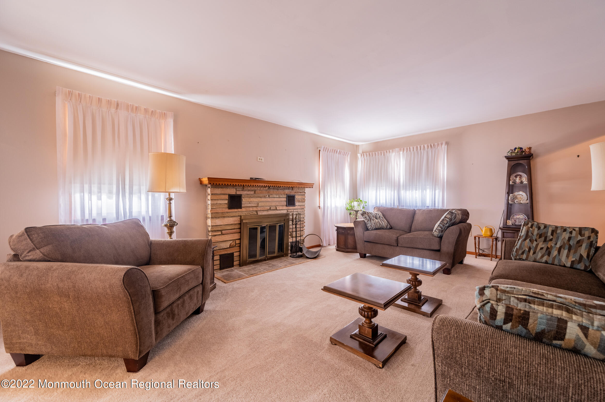 23 Neptune Road Toms River, NJ 08753 - Photo 4 of 36 a living room with furniture and a fireplace