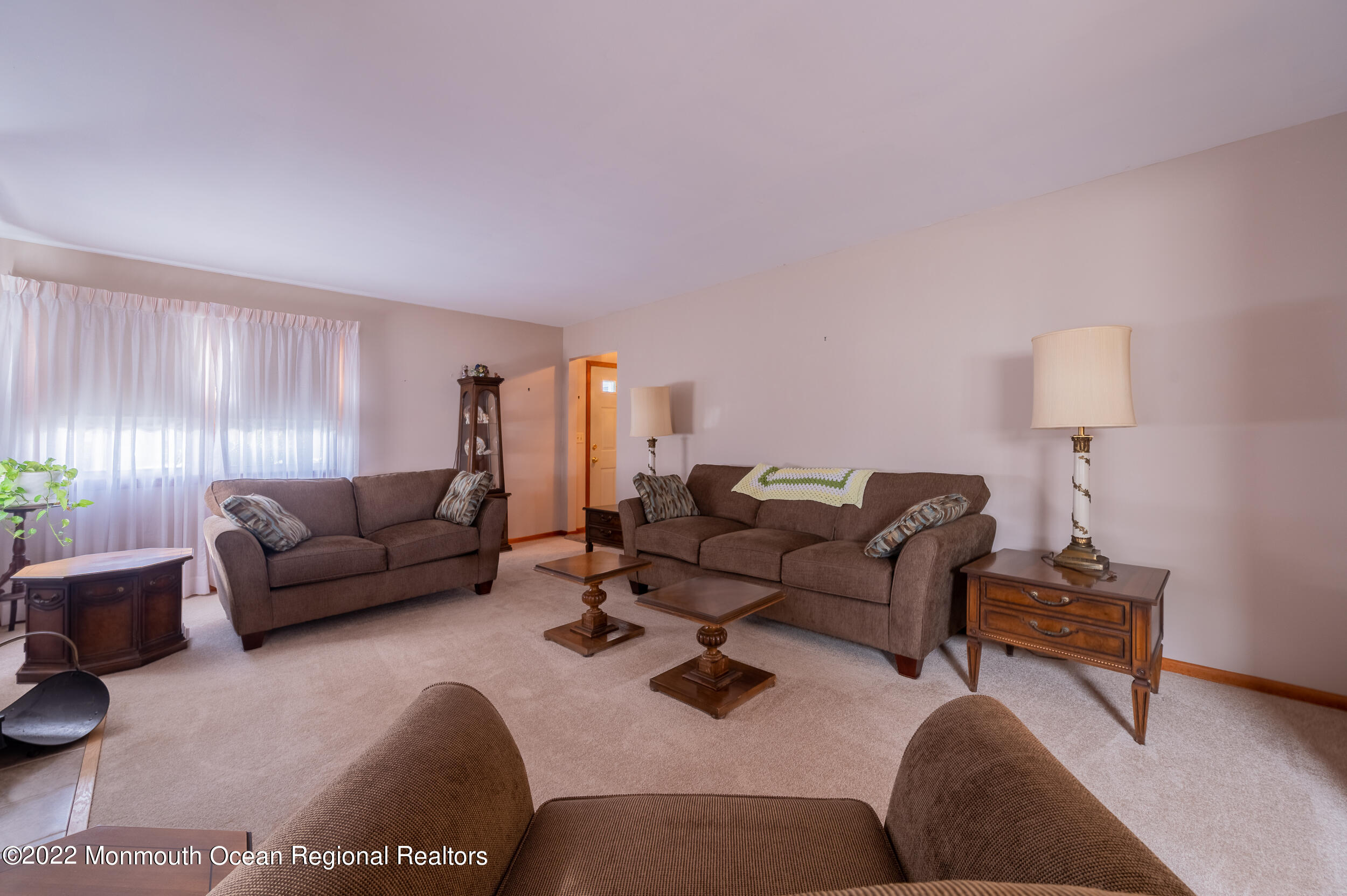 23 Neptune Road Toms River, NJ 08753 - Photo 5 of 36 a living room with furniture and a lamp