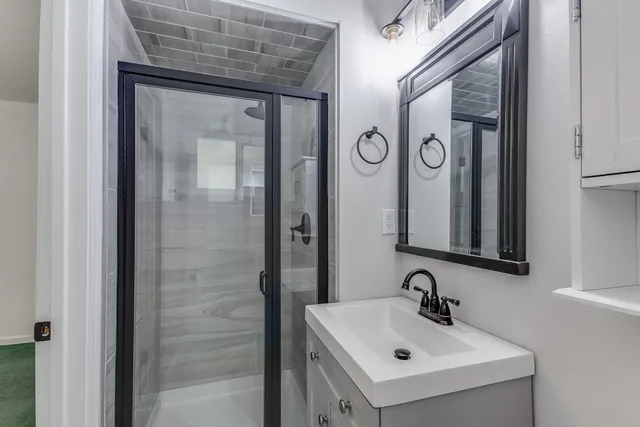 a bathroom with a sink and a mirror