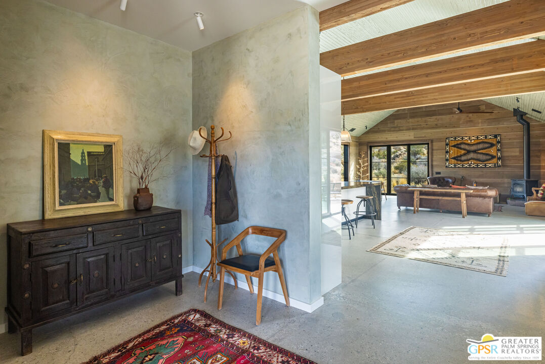 1653 Roadrunner Rut Pioneertown, CA 92268 - Photo 11 of 60 a living room with furniture and a window