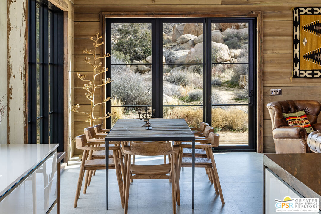 1653 Roadrunner Rut Pioneertown, CA 92268 - Photo 20 of 60 a view of a dining room with furniture and window