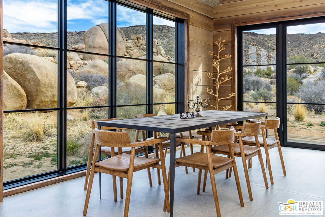1653 Roadrunner Rut Pioneertown, CA 92268 - Photo 21 of 60 a dining room with furniture and window