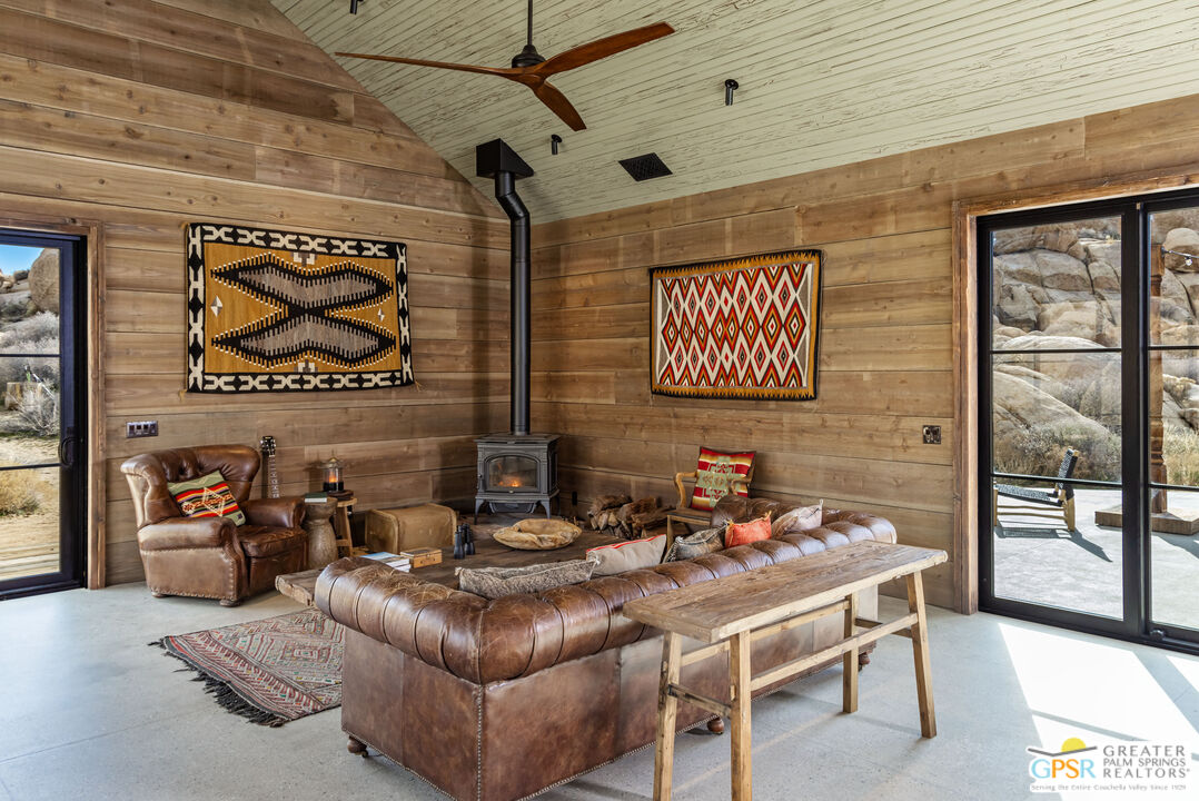 1653 Roadrunner Rut Pioneertown, CA 92268 - Photo 22 of 60 a living room with furniture and a window