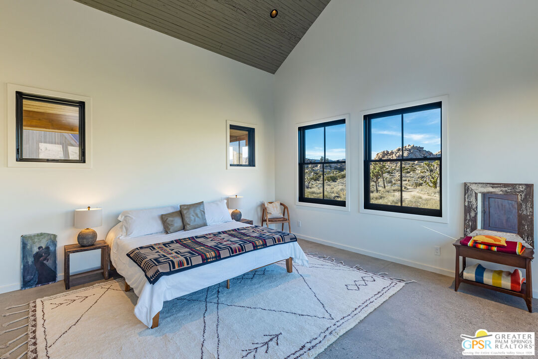 1653 Roadrunner Rut Pioneertown, CA 92268 - Photo 28 of 60 a living room with furniture and a window