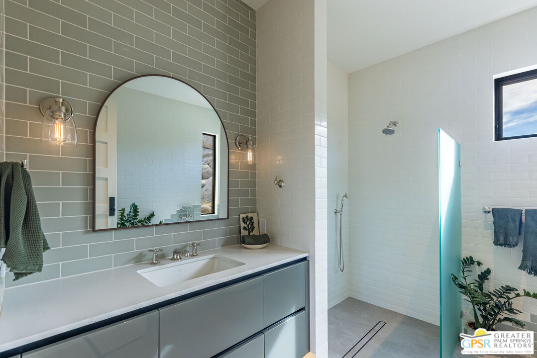 1653 Roadrunner Rut Pioneertown, CA 92268 - Photo 29 of 60 a bathroom with a sink and a mirror