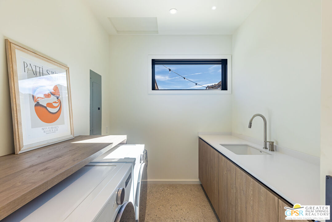 1653 Roadrunner Rut Pioneertown, CA 92268 - Photo 34 of 60 a view of a hallway with paintings on the wall