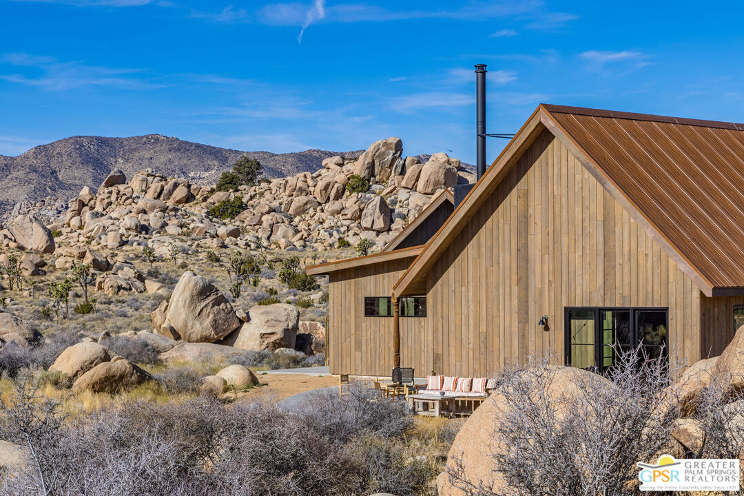1653 Roadrunner Rut Pioneertown, CA 92268 - Photo 37 of 60 a view of a house with a backyard