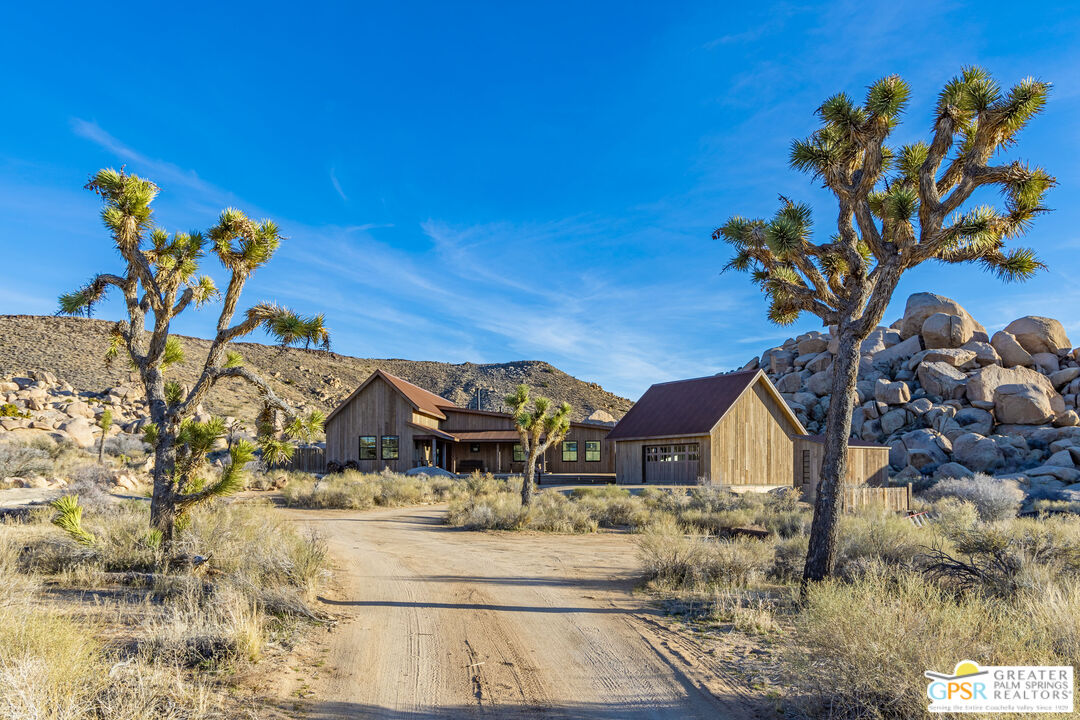 1653 Roadrunner Rut Pioneertown, CA 92268 - Photo 38 of 60 a view of a house with a yard