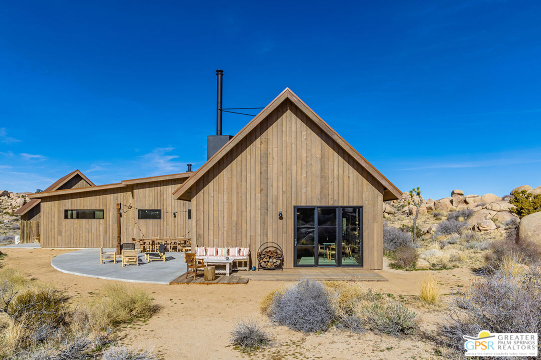 1653 Roadrunner Rut Pioneertown, CA 92268 - Photo 39 of 60 a view of a house with a patio