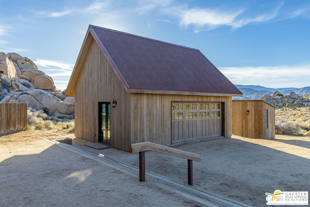 1653 Roadrunner Rut Pioneertown, CA 92268 - Photo 42 of 60 a view of a house with a yard