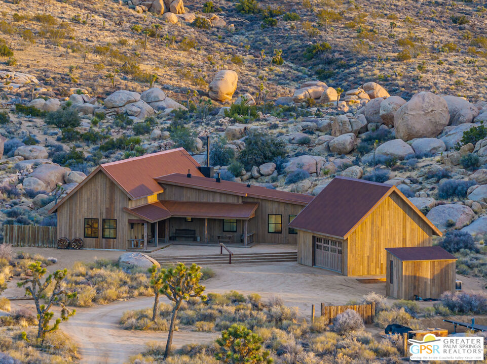 1653 Roadrunner Rut Pioneertown, CA 92268 - Photo 46 of 60 a front view of a house with garden