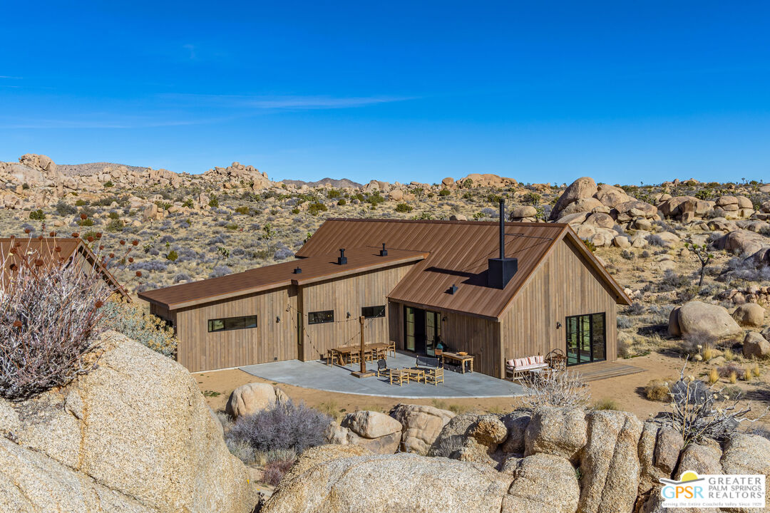 1653 Roadrunner Rut Pioneertown, CA 92268 - Photo 48 of 60 a view of a house with a snow in the background