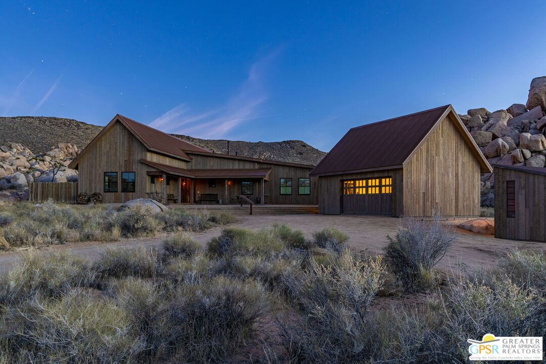 1653 Roadrunner Rut Pioneertown, CA 92268 - Photo 58 of 60 a view of a house with a yard and balcony