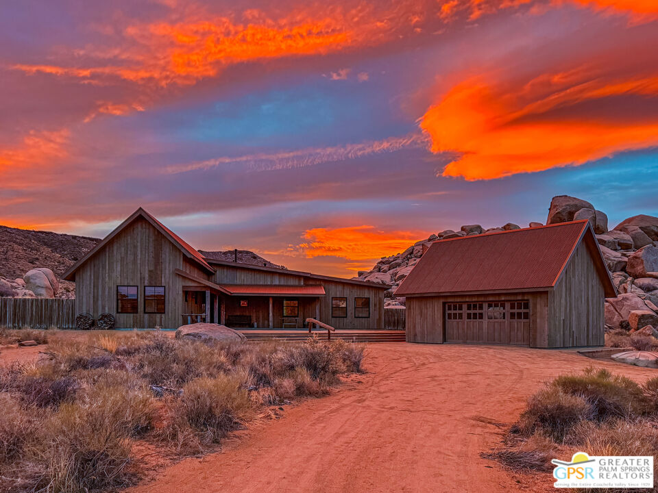 1653 Roadrunner Rut Pioneertown, CA 92268 - Photo 60 of 60 a front view of a house with a yard