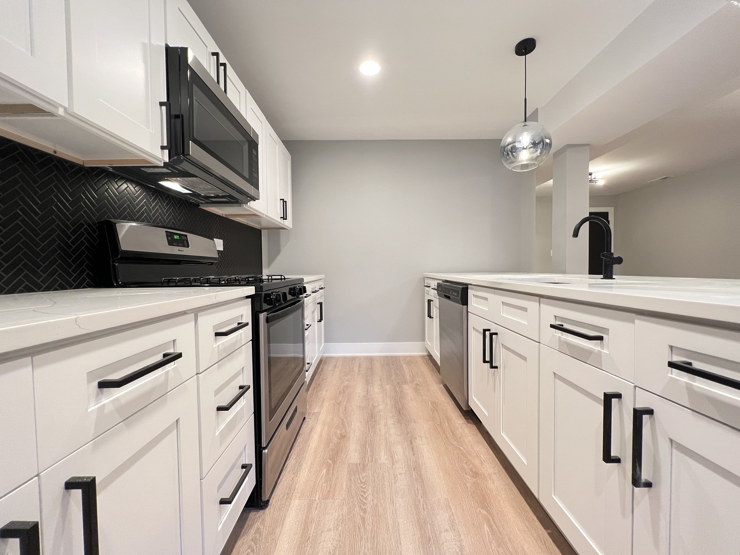 911 South Miller Street, Unit G Chicago, IL 60607 - Photo 6 of 11 a kitchen with a sink appliances and cabinets