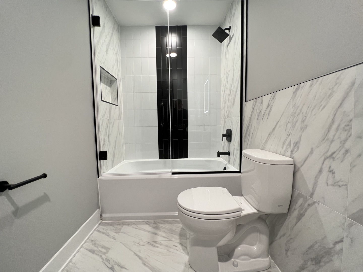 911 South Miller Street, Unit G Chicago, IL 60607 - Photo 7 of 11 a bathroom with a toilet and a shower