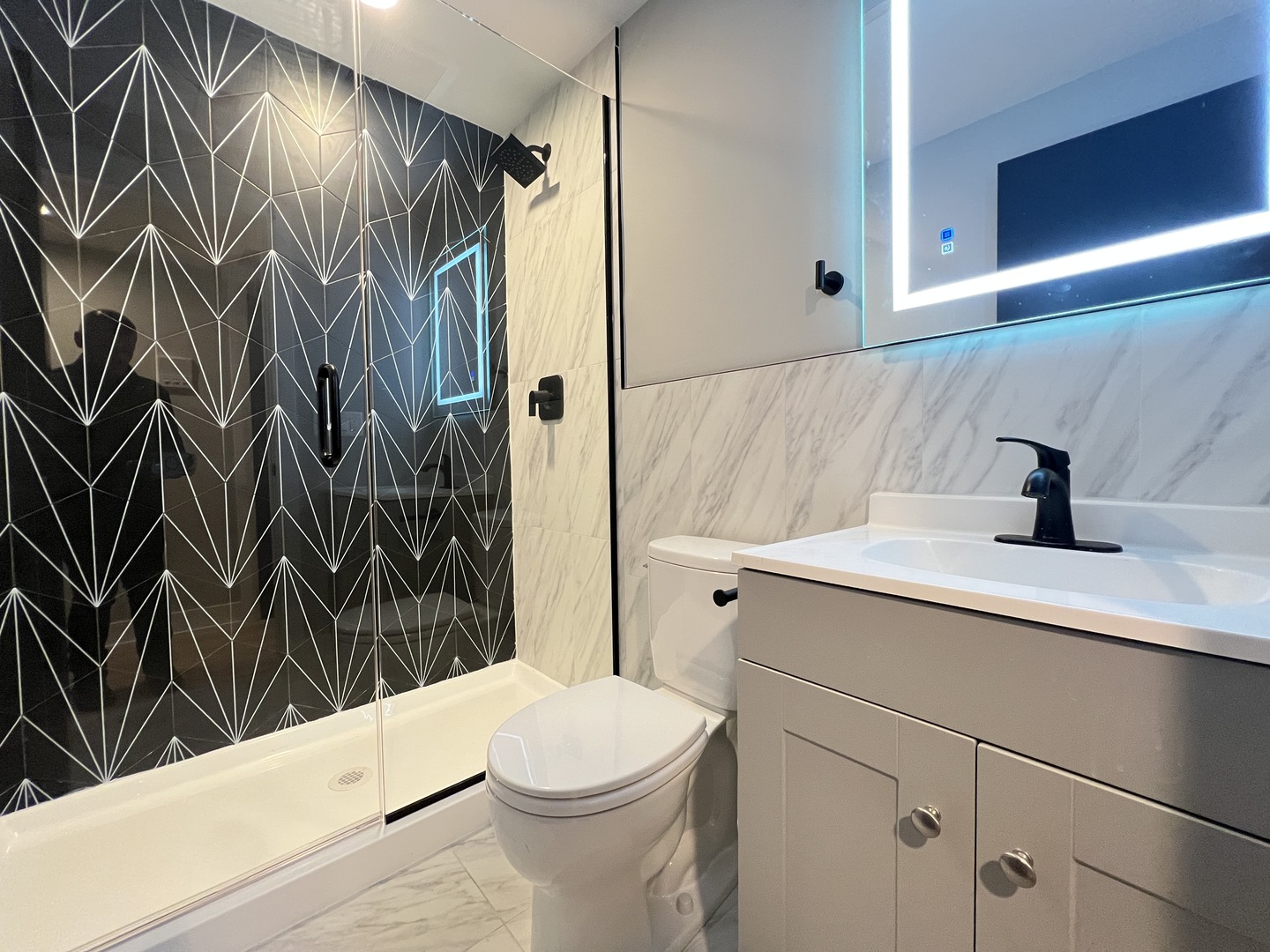 911 South Miller Street, Unit G Chicago, IL 60607 - Photo 9 of 11 a bathroom with a sink a toilet and shower
