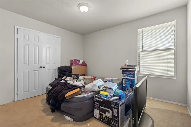 a bed room with a bed and a window