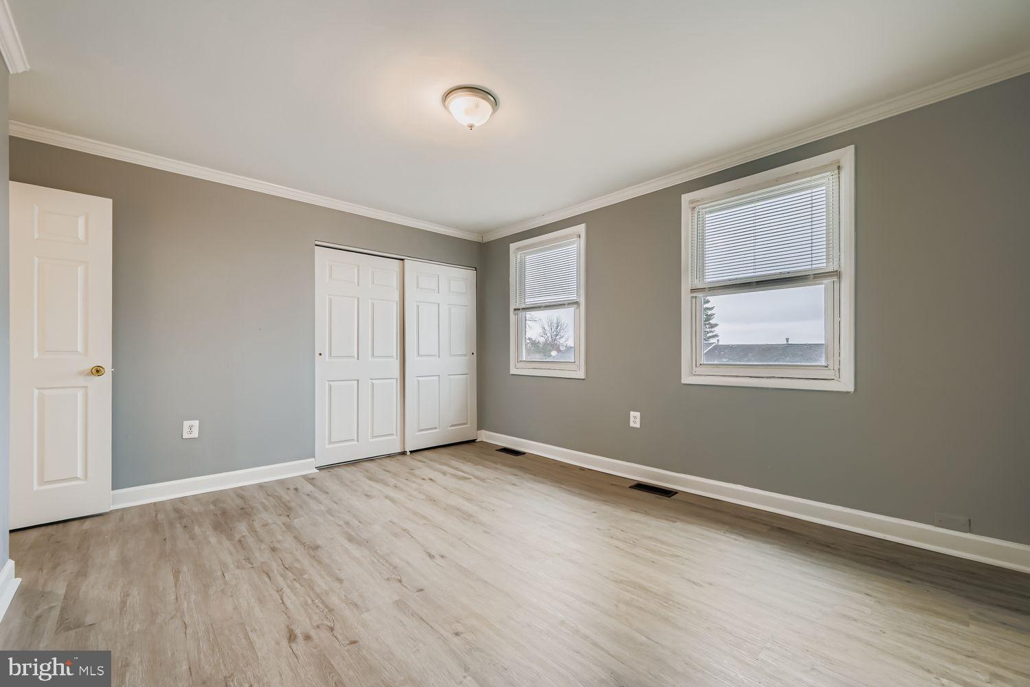 2610 Hallam Court, Unit 2610 Windsor Mill, MD 21244 - Photo 12 of 17 a view of an empty room with wooden floor and a window