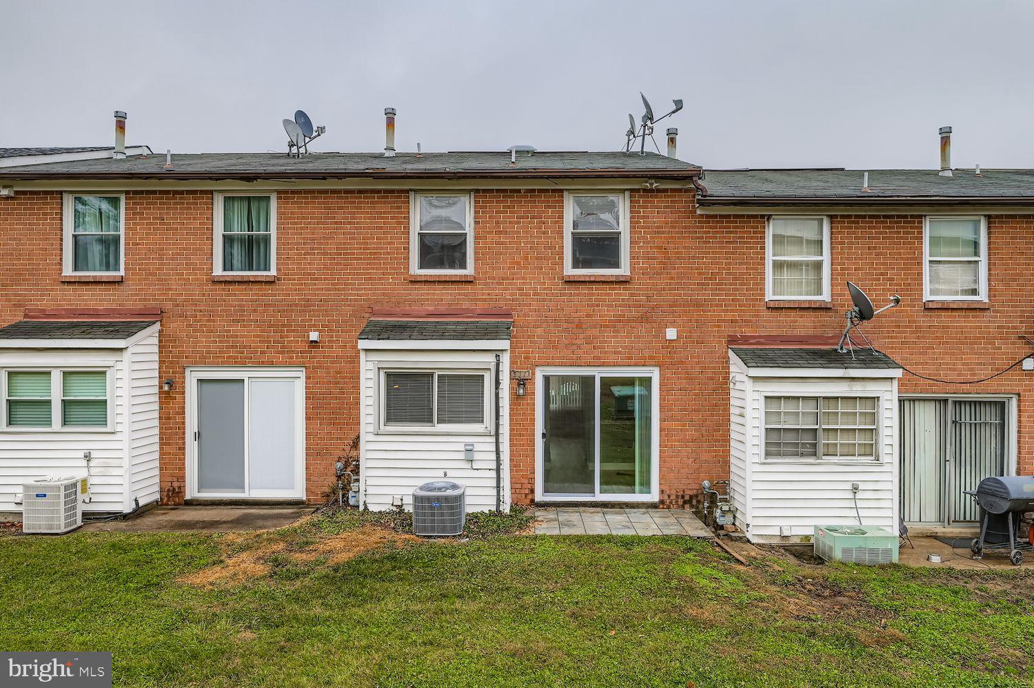 2610 Hallam Court, Unit 2610 Windsor Mill, MD 21244 - Photo 17 of 17 a front view of a house with a yard