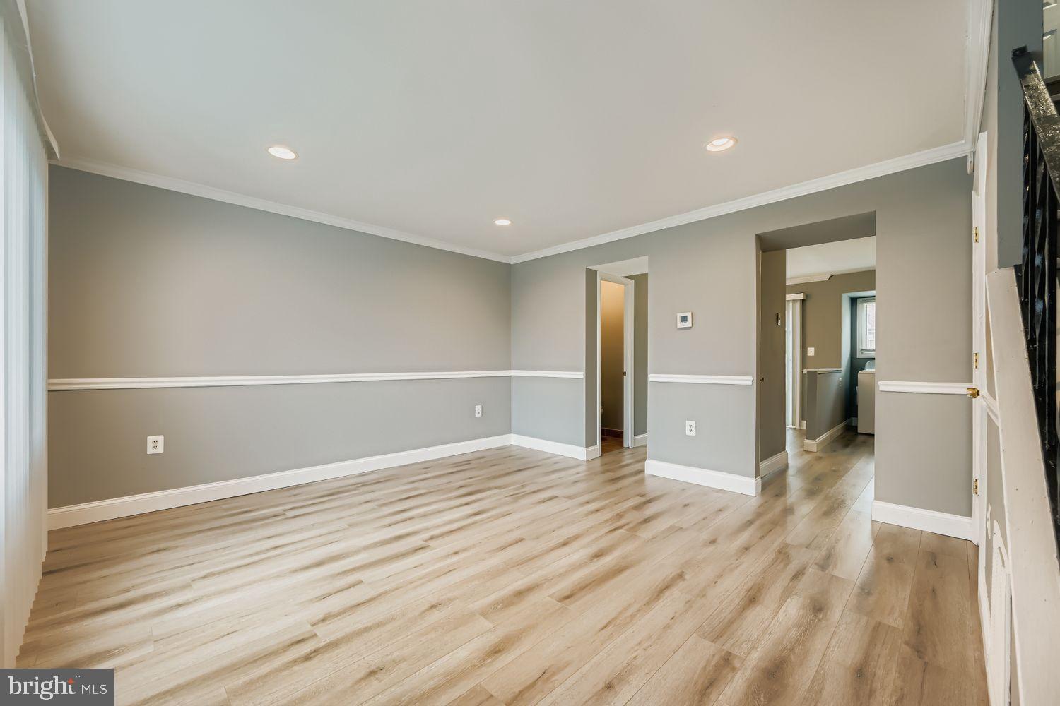 2610 Hallam Court, Unit 2610 Windsor Mill, MD 21244 - Photo 5 of 17 a view of a livingroom with wooden floor