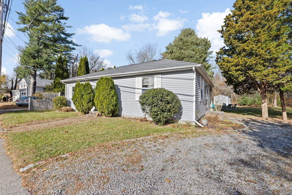 973 Point Road Marion, MA 02738 - Photo 29 of 33 a view of a house with a yard and plants