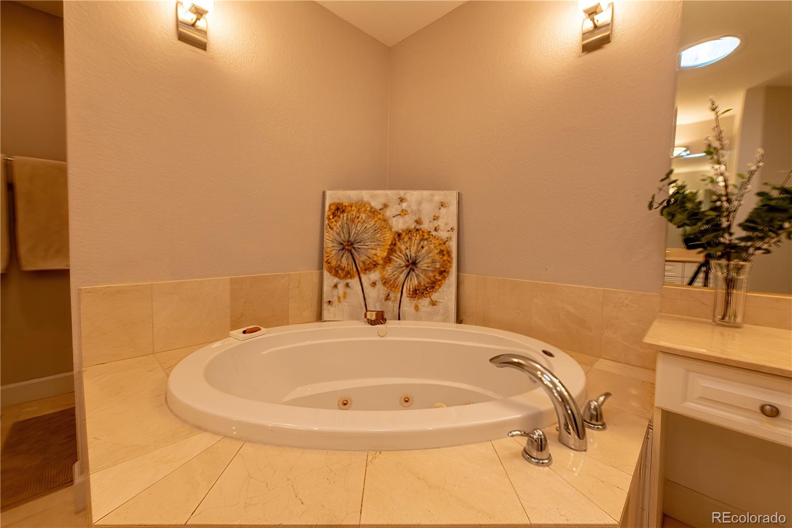 566 Josephine Street Denver, CO 80206 - Photo 16 of 45 a bathroom with a tub and a sink