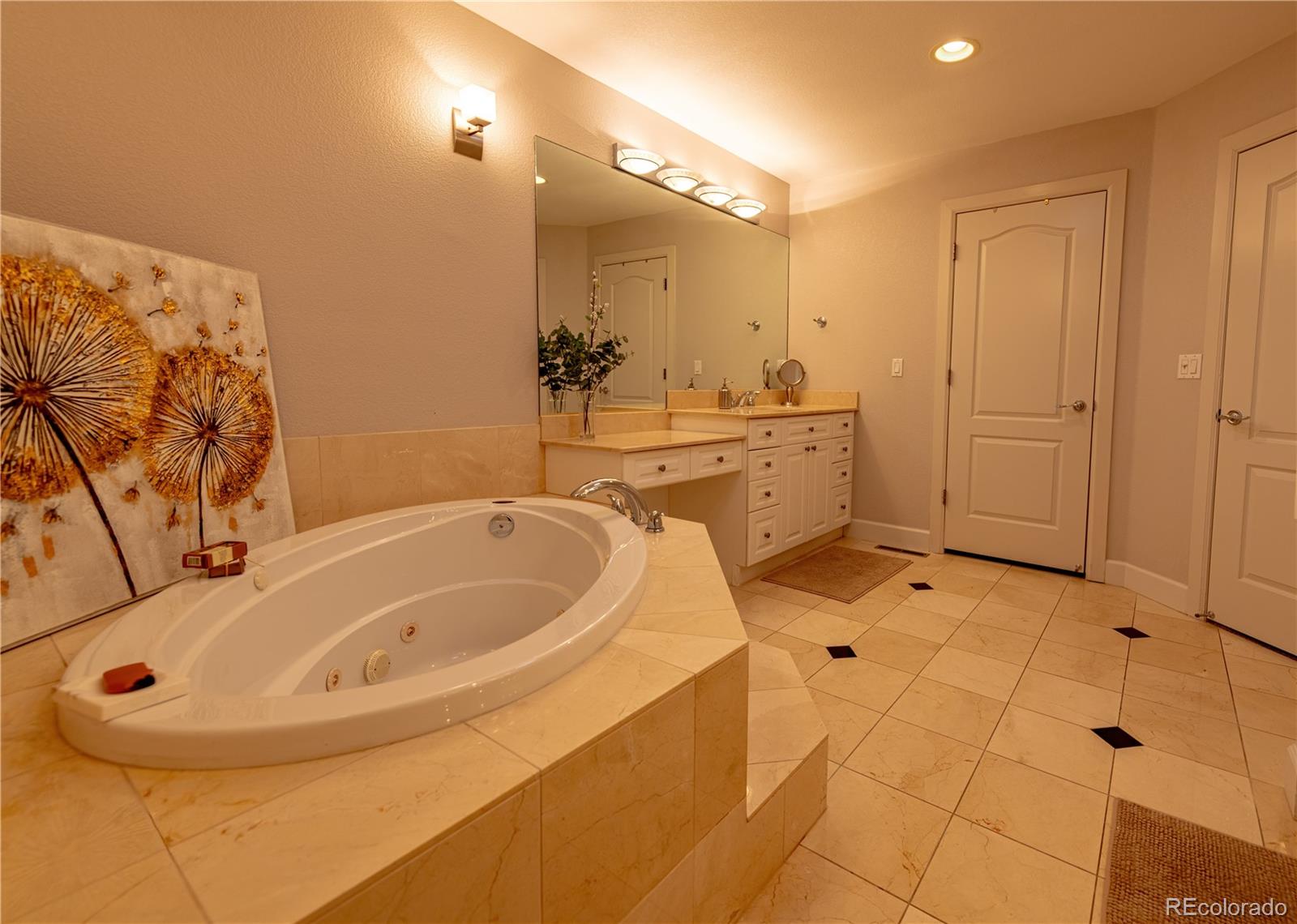 566 Josephine Street Denver, CO 80206 - Photo 17 of 45 a bathroom with a bathtub and a sink