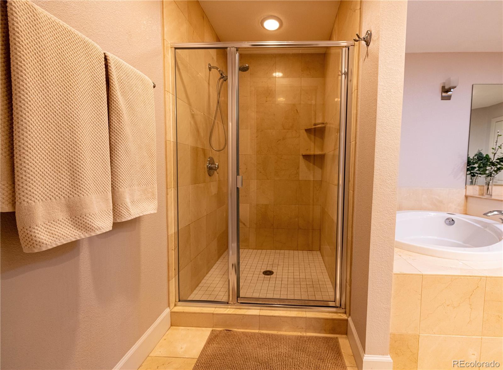 566 Josephine Street Denver, CO 80206 - Photo 18 of 45 a bathroom with a shower and a sink