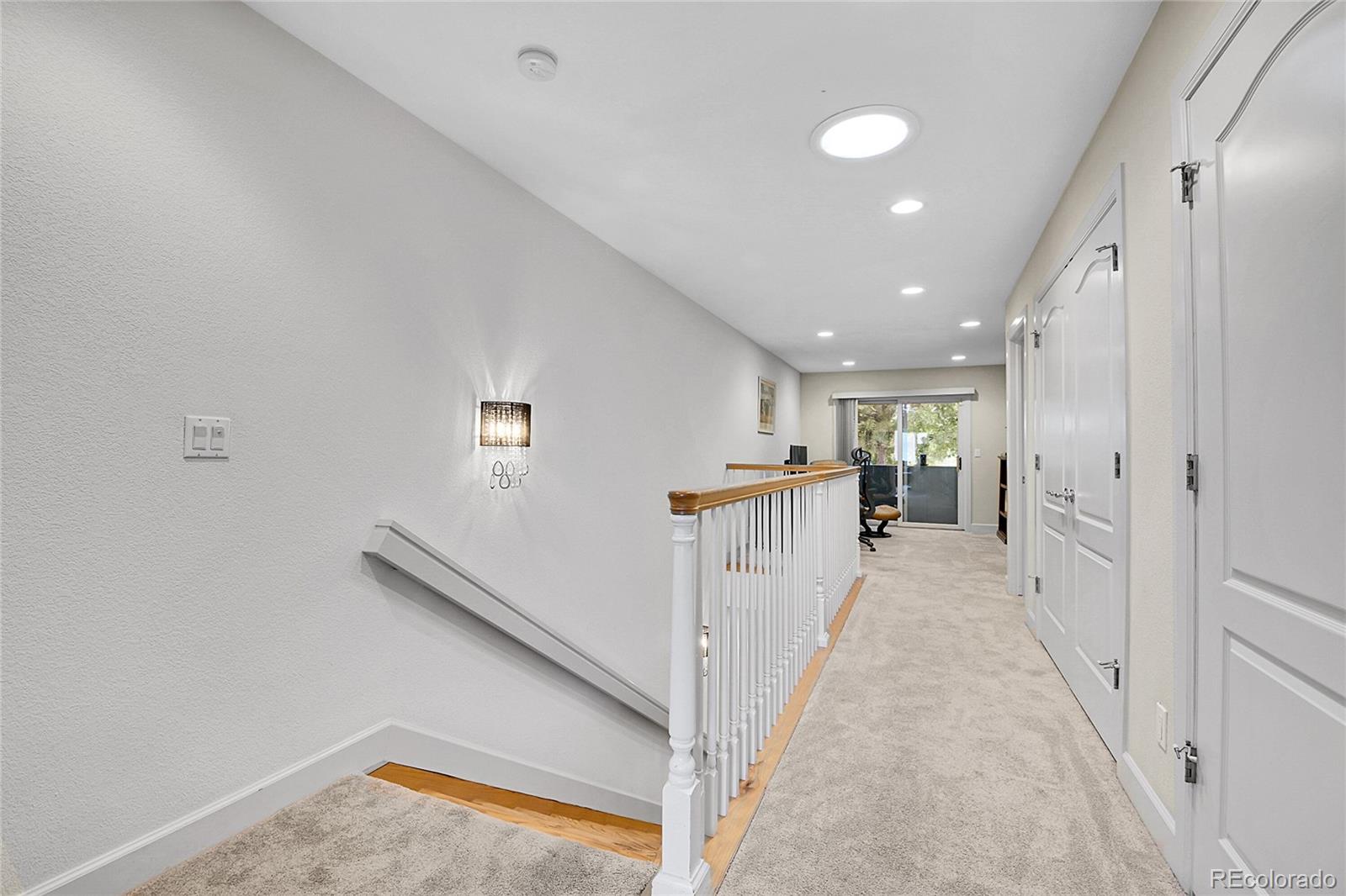 566 Josephine Street Denver, CO 80206 - Photo 20 of 45 a view of a hallway with stairs
