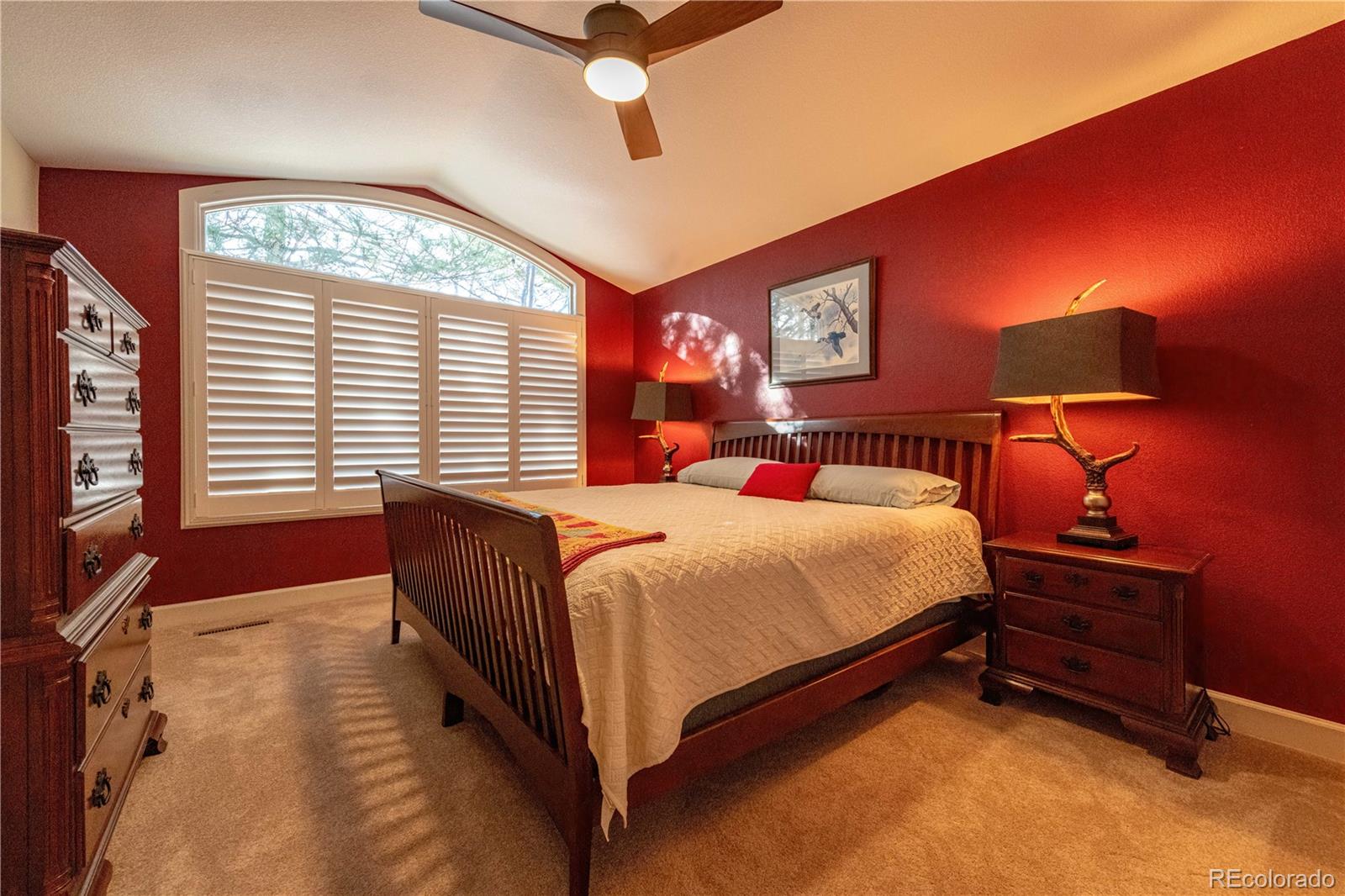 566 Josephine Street Denver, CO 80206 - Photo 22 of 45 a bedroom with a bed and a flat screen tv