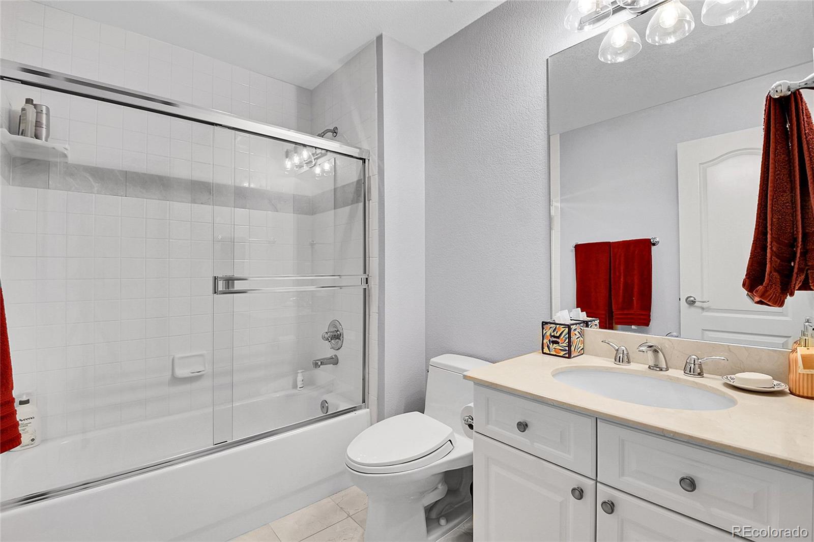 566 Josephine Street Denver, CO 80206 - Photo 23 of 45 a bathroom with a sink toilet and shower