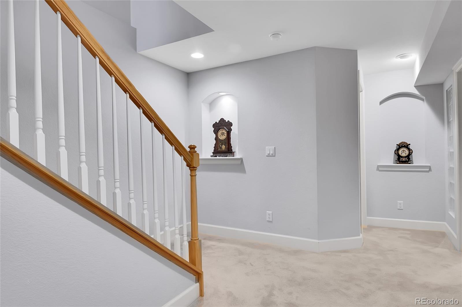 566 Josephine Street Denver, CO 80206 - Photo 24 of 45 a view of a hallway with a staircase