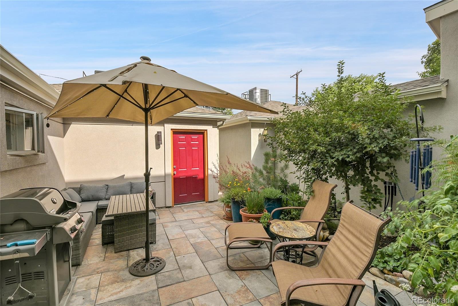 566 Josephine Street Denver, CO 80206 - Photo 31 of 45 a view of backyard of house with seating space