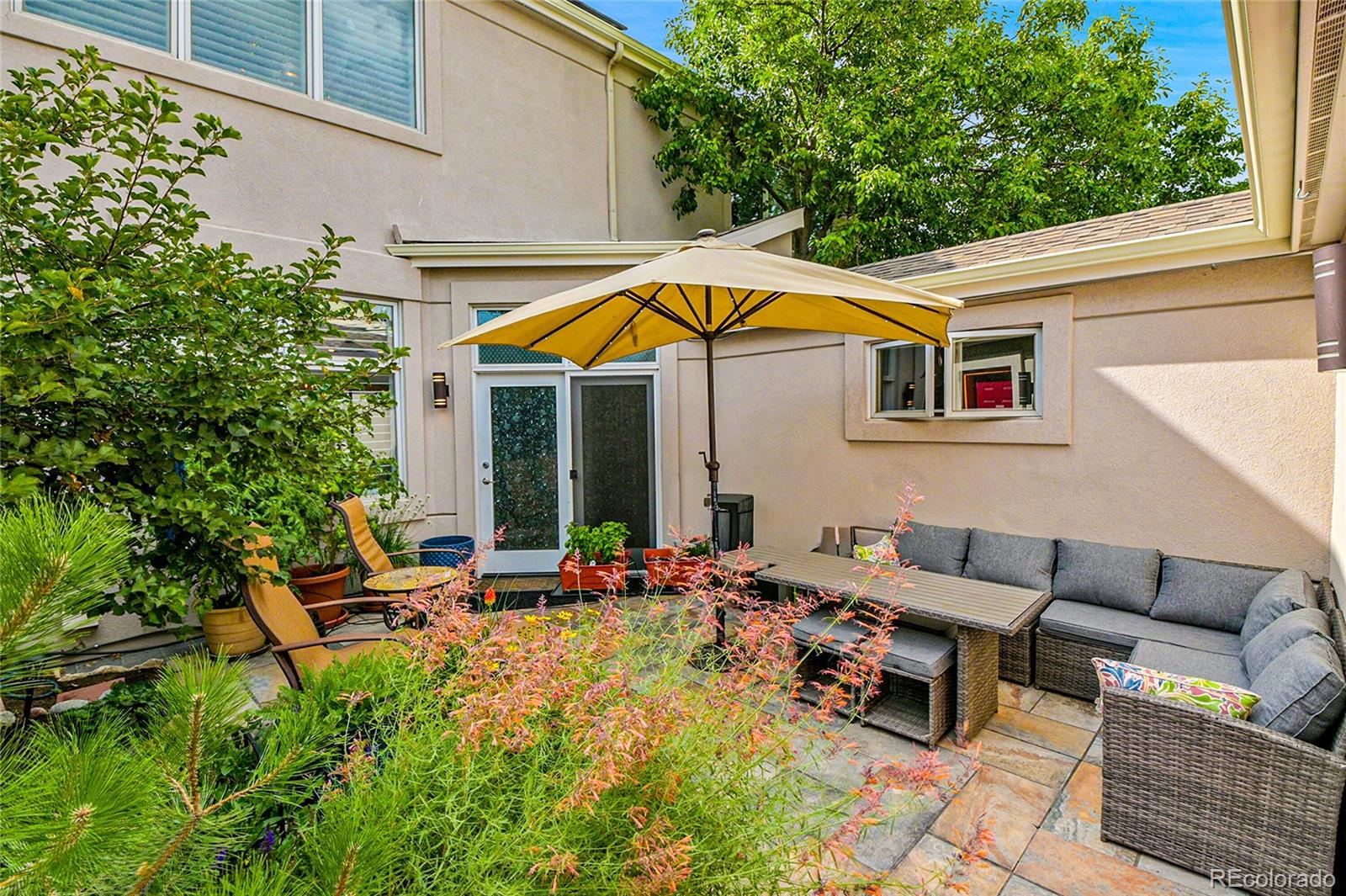 566 Josephine Street Denver, CO 80206 - Photo 32 of 45 a backyard of a house with seating space