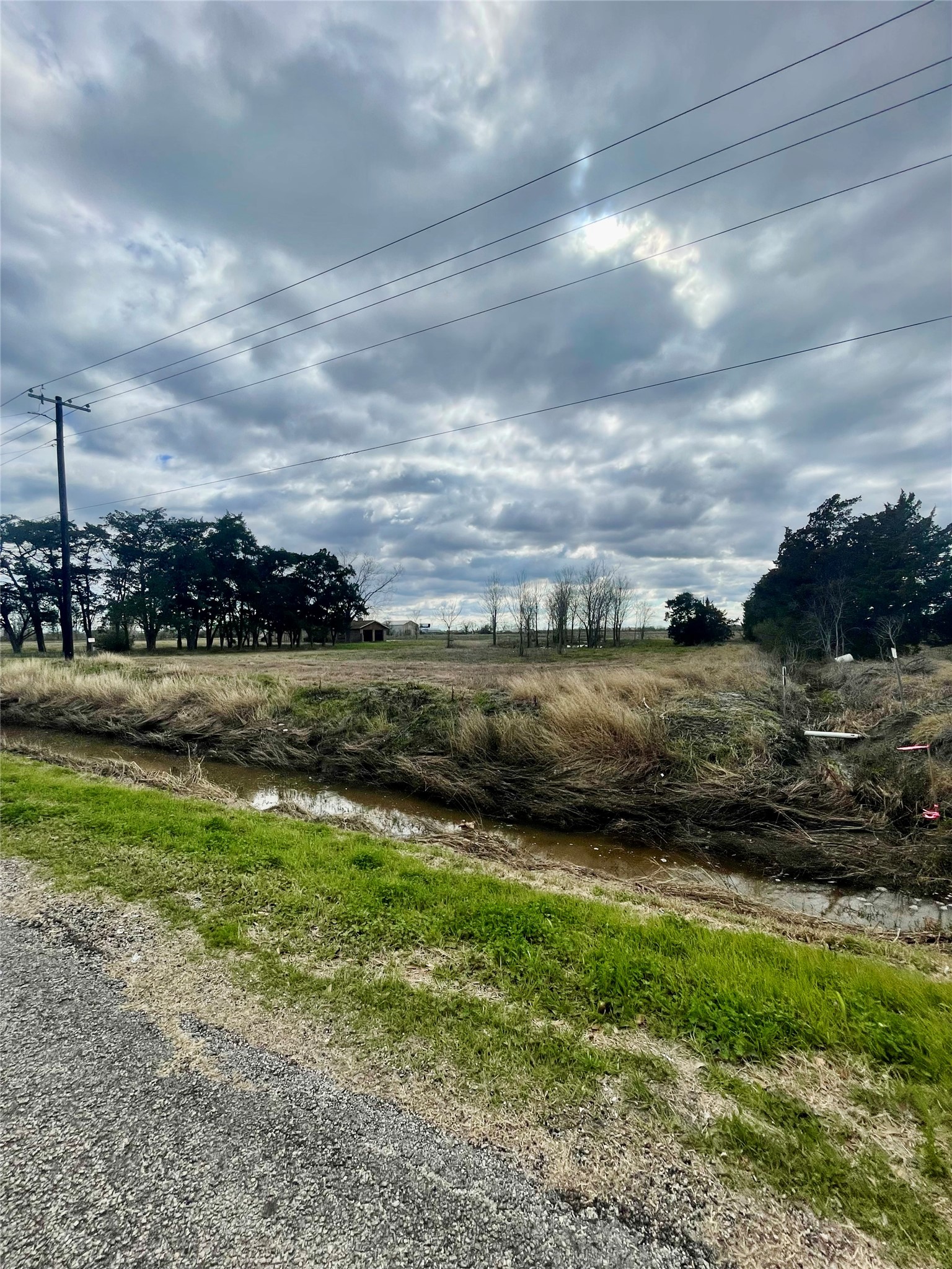 145 8th Street Van Vleck, TX 77482 - Photo 2 of 2 a view of a lake with houses in the back
