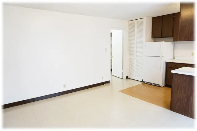 a view of a kitchen with a sink and a microwave