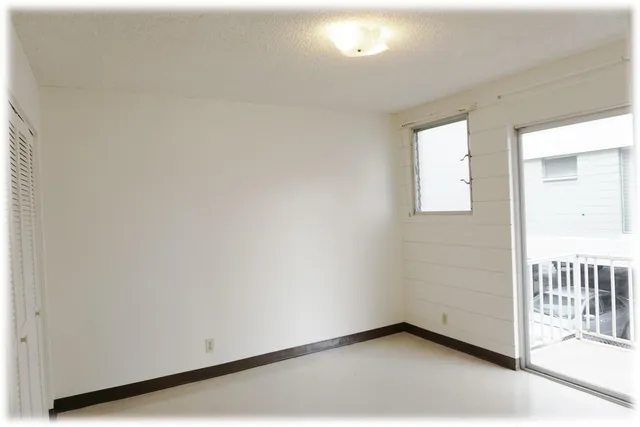 an empty room with a bench