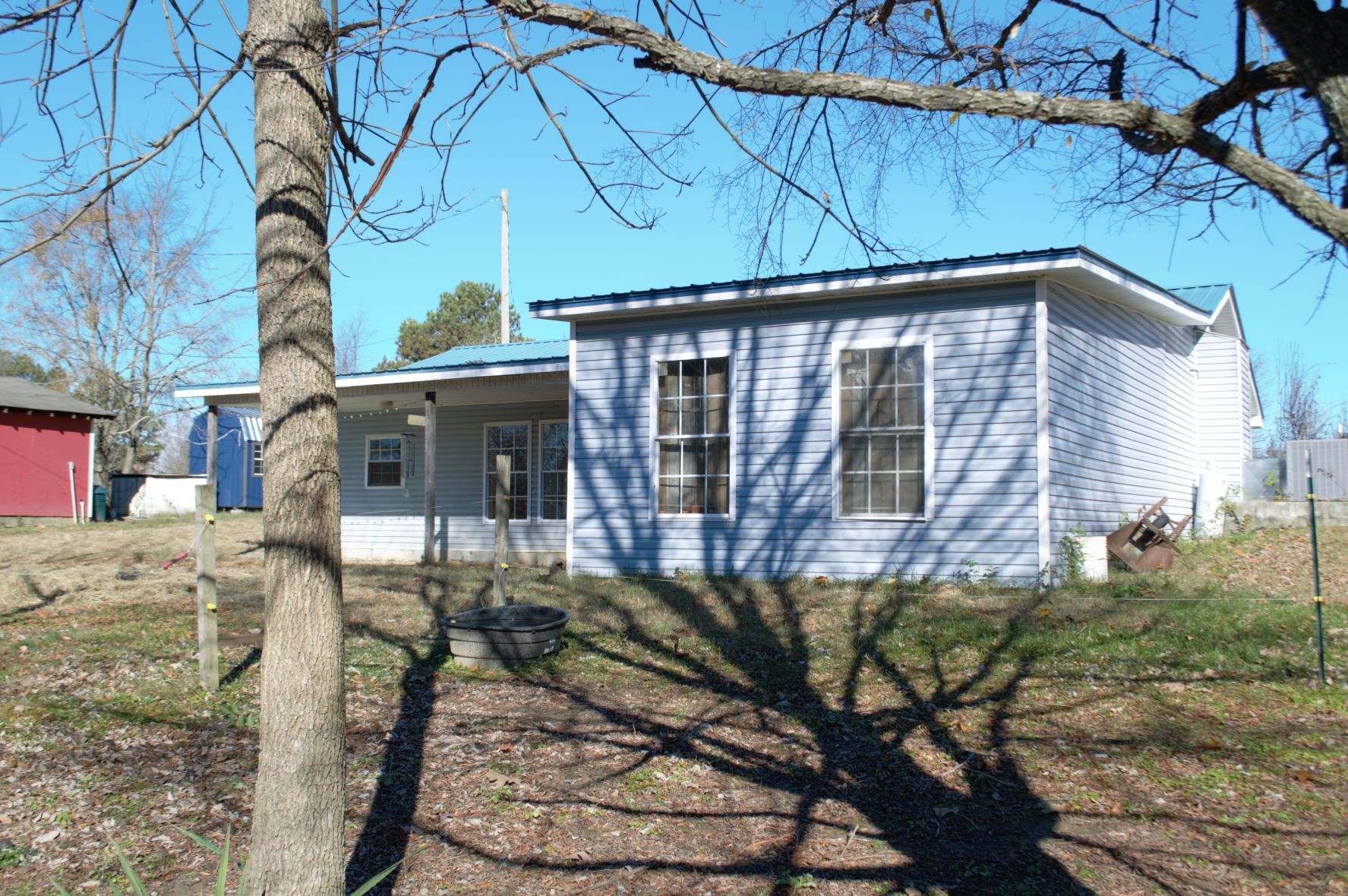 2151 Baggett Road Palmyra, TN 37142 - Photo 1 of 29 a front view of a house with garden