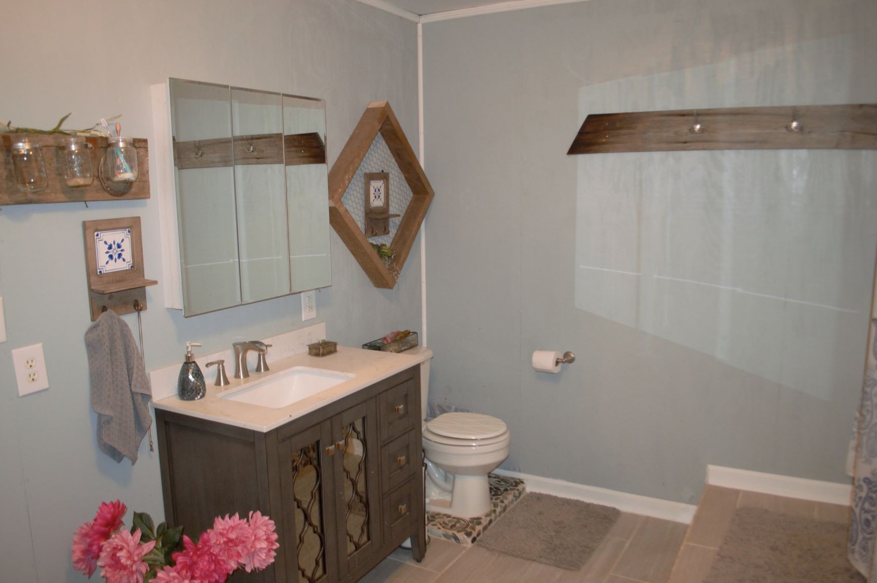 2151 Baggett Road Palmyra, TN 37142 - Photo 11 of 29 a bathroom with a sink mirror and toilet