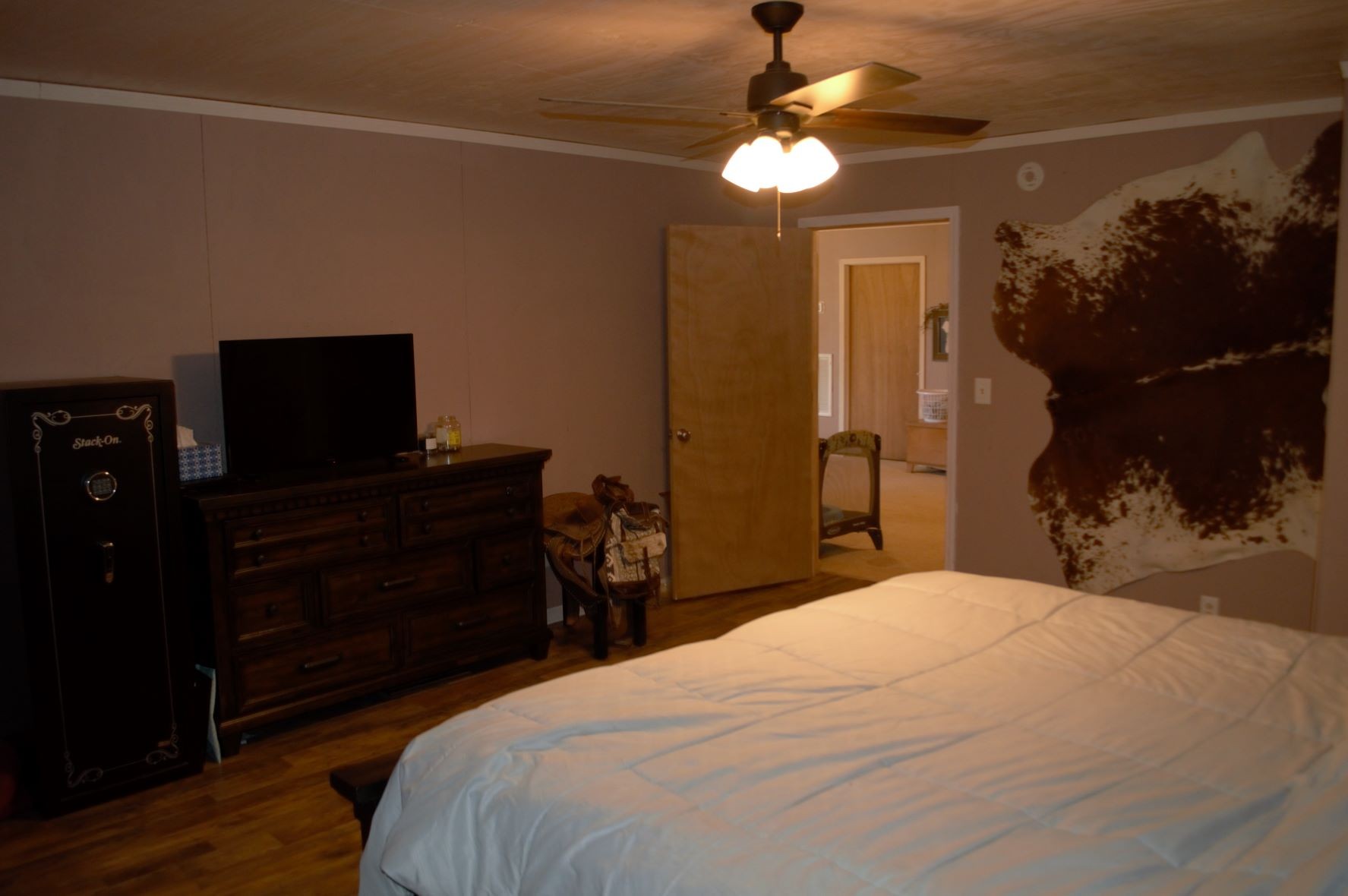 2151 Baggett Road Palmyra, TN 37142 - Photo 15 of 29 a bedroom with a bed and a chandelier