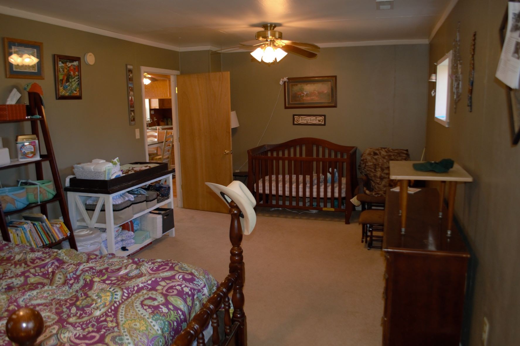 2151 Baggett Road Palmyra, TN 37142 - Photo 20 of 29 a bedroom with a bed and a chandelier