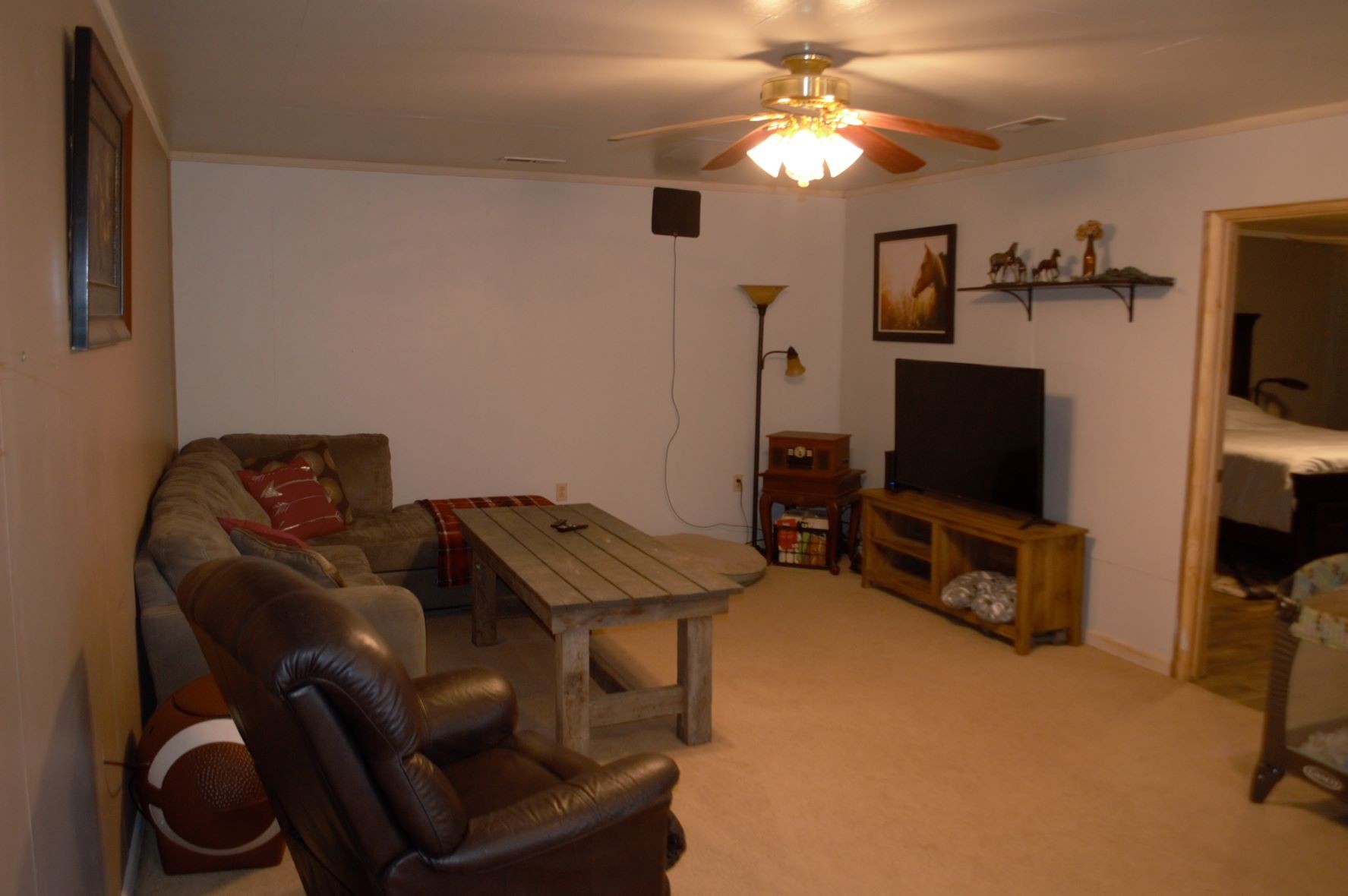 2151 Baggett Road Palmyra, TN 37142 - Photo 3 of 29 a living room with furniture and a flat screen tv