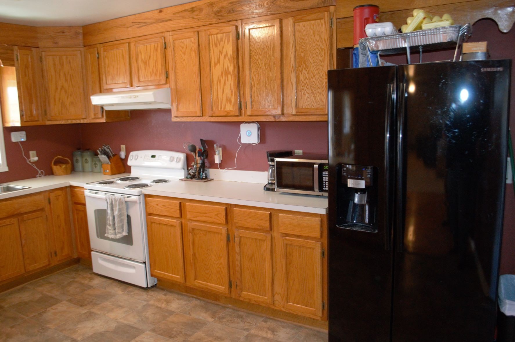 2151 Baggett Road Palmyra, TN 37142 - Photo 5 of 29 a kitchen with stainless steel appliances granite countertop a refrigerator a sink a stove and dishwasher with wooden cabinets