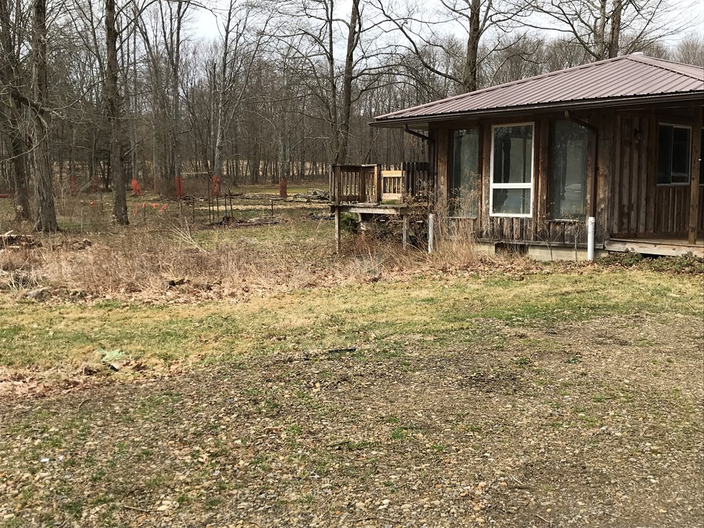 213 Stone Road Franklin, PA 16323 - Photo 2 of 28 a backyard of a house with table and chairs