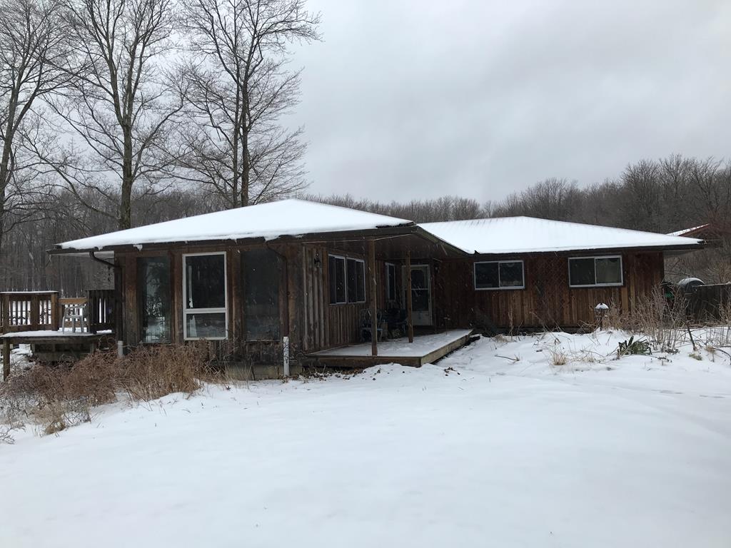 213 Stone Road Franklin, PA 16323 - Photo 23 of 28 a front view of a house with a yard covered in snow