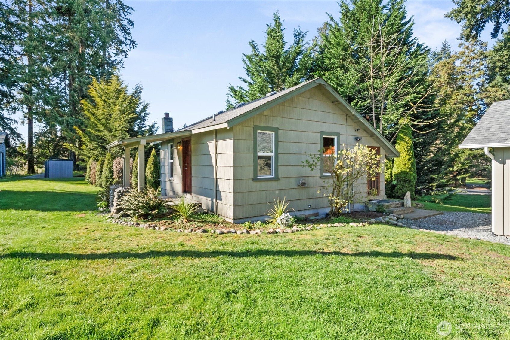 1000 Creso Road South Spanaway, WA 98387 - Photo 31 of 40 a front view of house with yard and green space