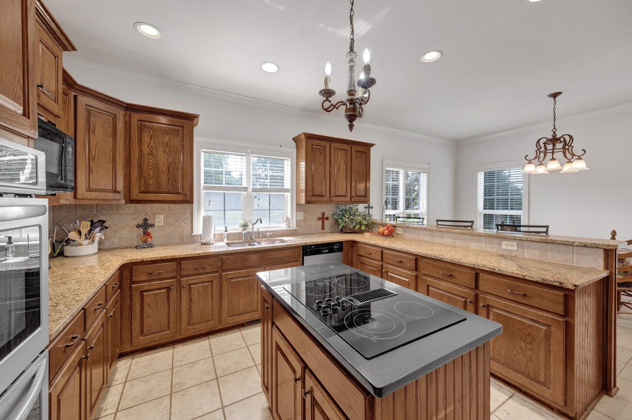 914 Beaver Creek Road Brighton, TN 38011 - Photo 11 of 38 a kitchen with a stove sink and cabinets