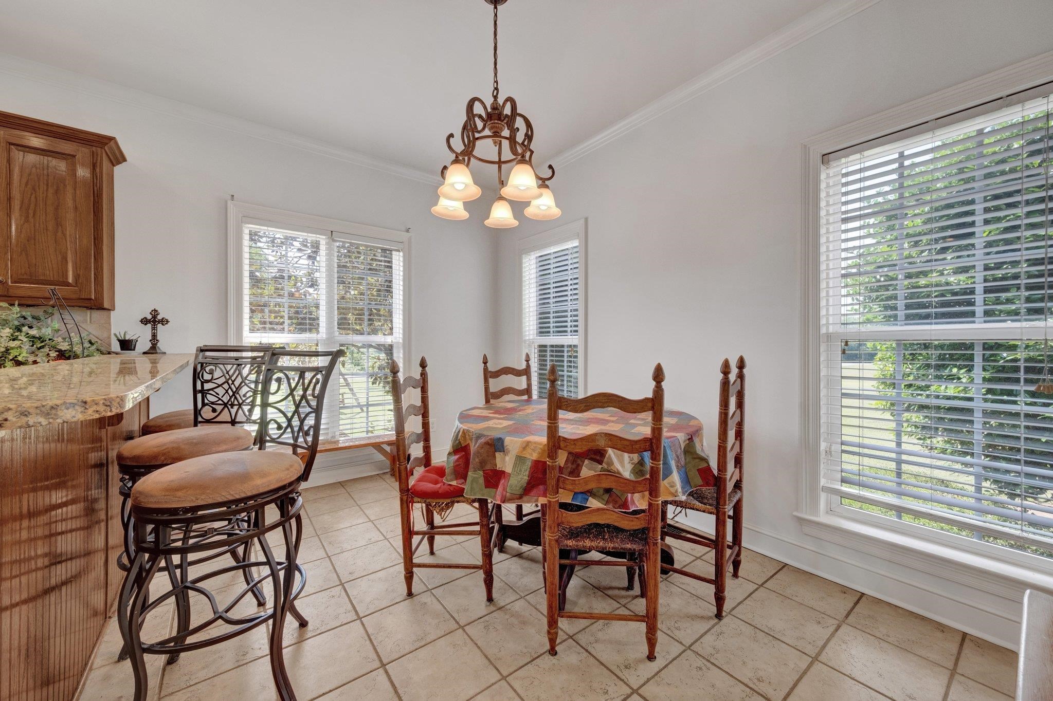 914 Beaver Creek Road Brighton, TN 38011 - Photo 13 of 38 a dining room with furniture a chandelier and window